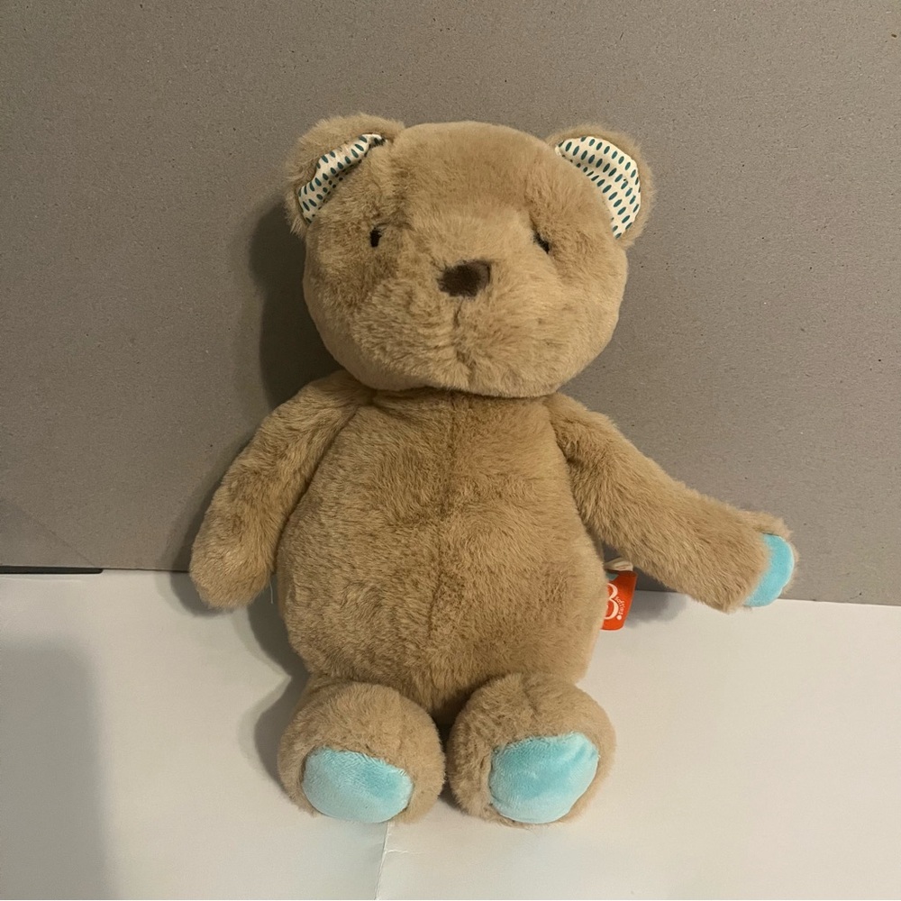 B softies teddy bear with tan fur and turquoise paws and feet.